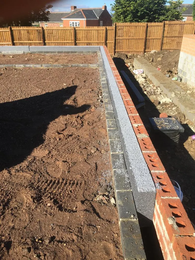 Cavity wall foundation with insulation and brickwork on site