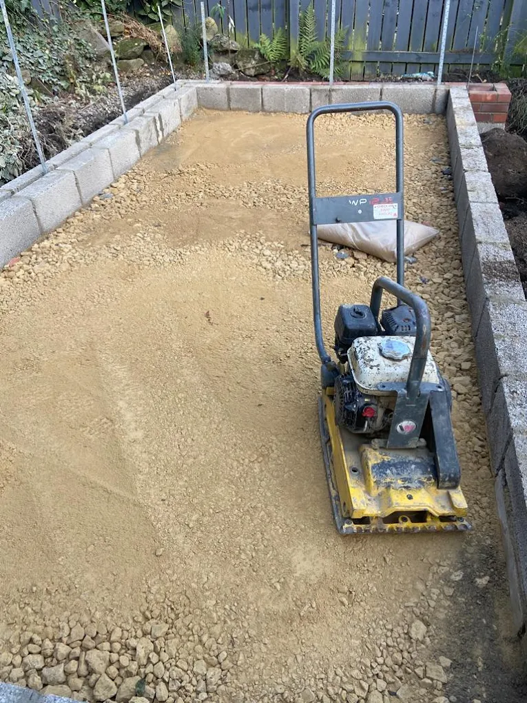 Concrete base preparation with compacted sub-base and wacker plate